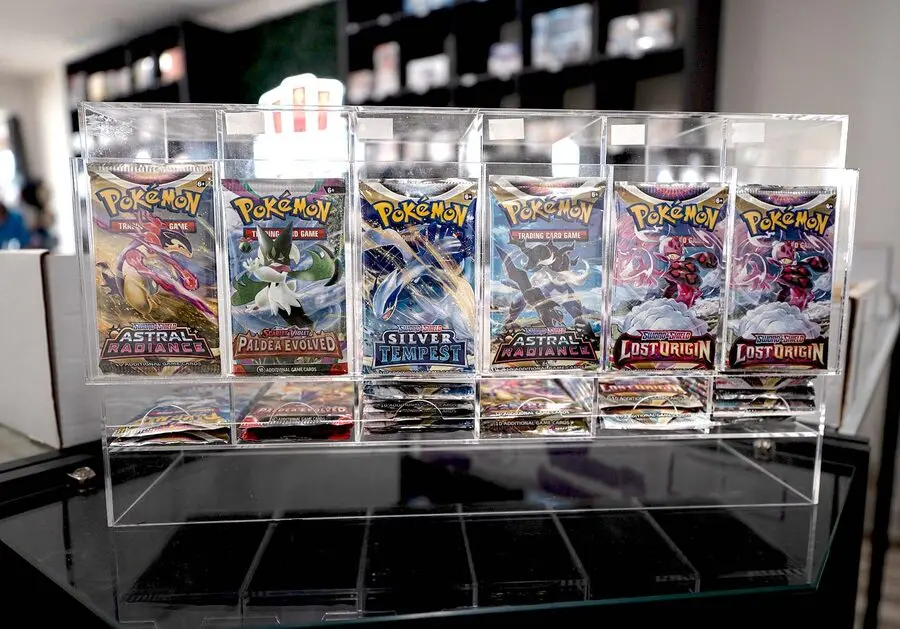 Display cases and graded cards inside Home Field Hobby Shop