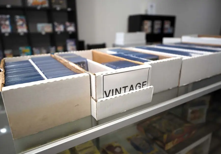 Sealed boxes and card inventory on the shelves